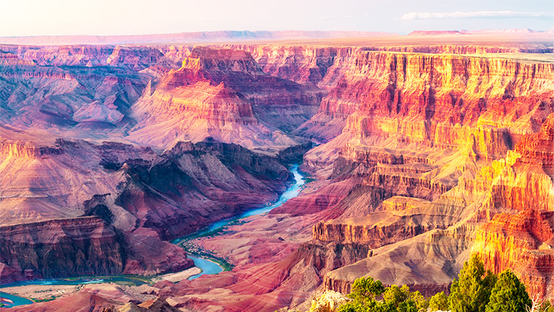 Grand Canyon National Park has its layered bands of red rock revealing millions of years of geological history.